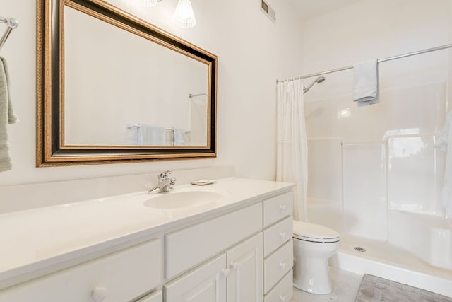 full bath featuring a shower with curtain, vanity, toilet, and tile patterned flooring