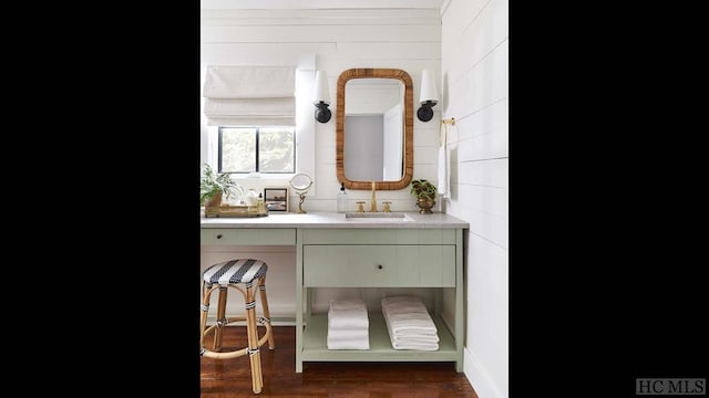 bathroom with vanity and wood-type flooring