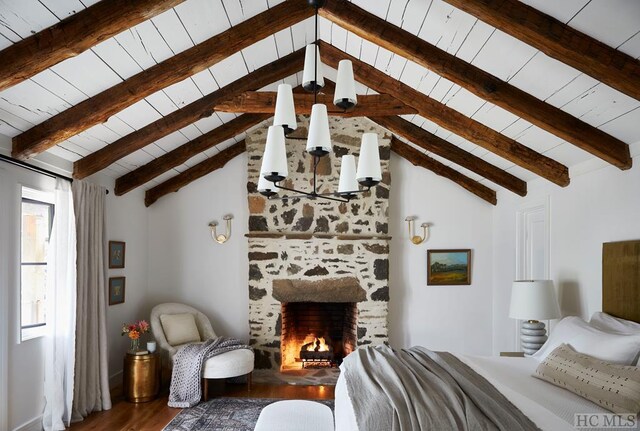 bedroom featuring a fireplace, vaulted ceiling with beams, wood ceiling, and hardwood / wood-style floors