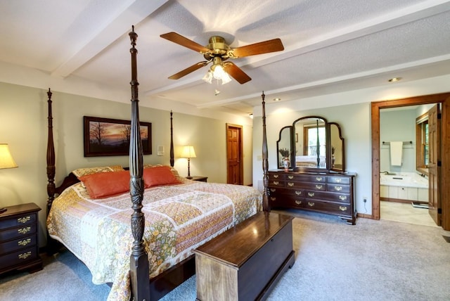 40 Piney Ridge Ct, Sapphire, NC 28774 - carpeted bedroom featuring beamed ceiling, connected bathroom, and a ceiling fan