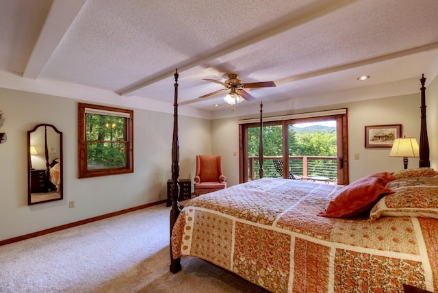 40 Piney Ridge Ct, Sapphire, NC 28774 - bedroom with access to exterior, carpet, a textured ceiling, beamed ceiling, and ceiling fan