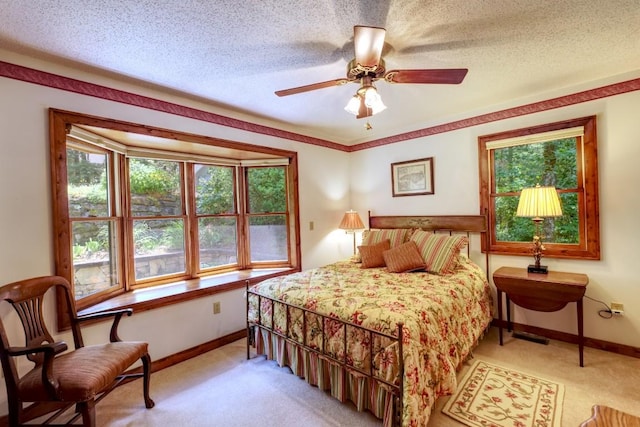 40 Piney Ridge Ct, Sapphire, NC 28774 - bedroom with light carpet, a textured ceiling, and ceiling fan