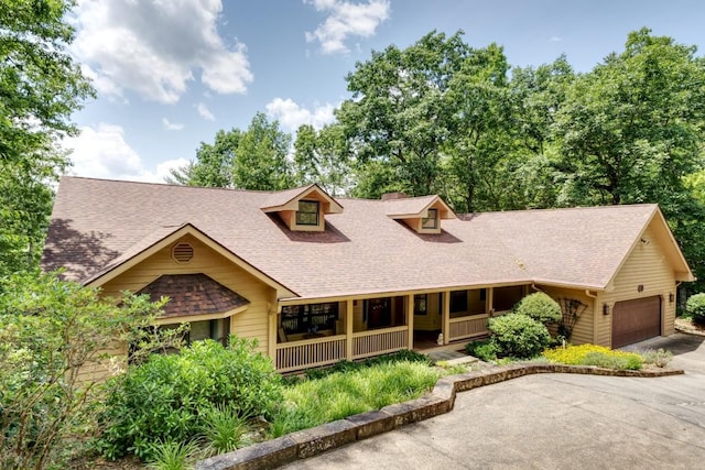 40 Piney Ridge Ct, Sapphire, NC 28774 - view of front of house featuring covered porch, an attached garage, a shingled roof, and concrete driveway