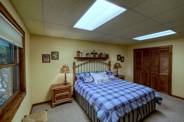 40 Piney Ridge Ct, Sapphire, NC 28774 - bedroom with light carpet, a drop ceiling, and a closet