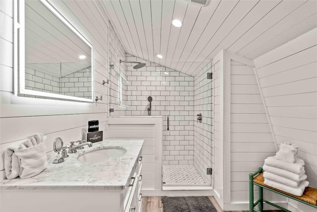 full bath with a shower stall, recessed lighting, and vanity