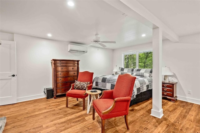 bedroom featuring a wall mounted air conditioner, light wood-style floors, recessed lighting, baseboards, and ceiling fan