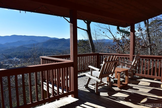 wooden terrace with a mountain view