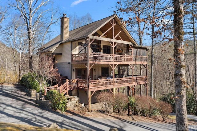 back of property with a wooden deck