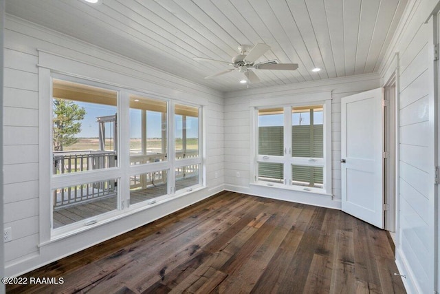 unfurnished sunroom with wooden ceiling and ceiling fan