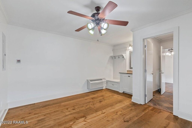 unfurnished room with ceiling fan, crown molding, and wood-type flooring