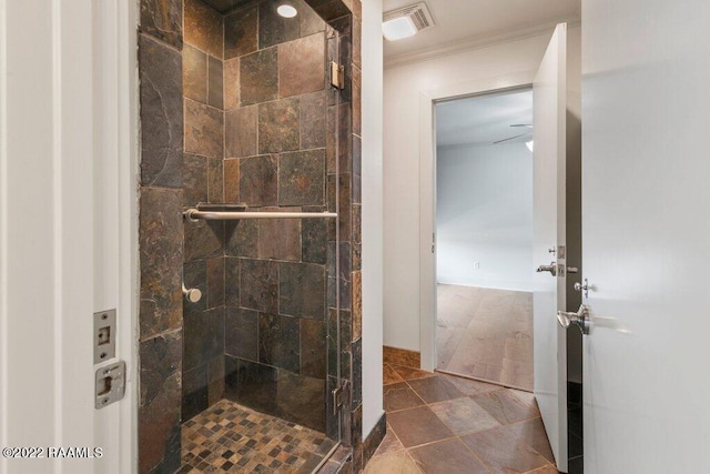 bathroom with crown molding, wood-type flooring, and a shower with shower door