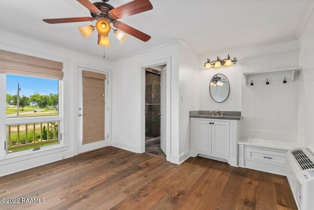 interior space featuring vanity, ceiling fan, hardwood / wood-style flooring, and ornamental molding