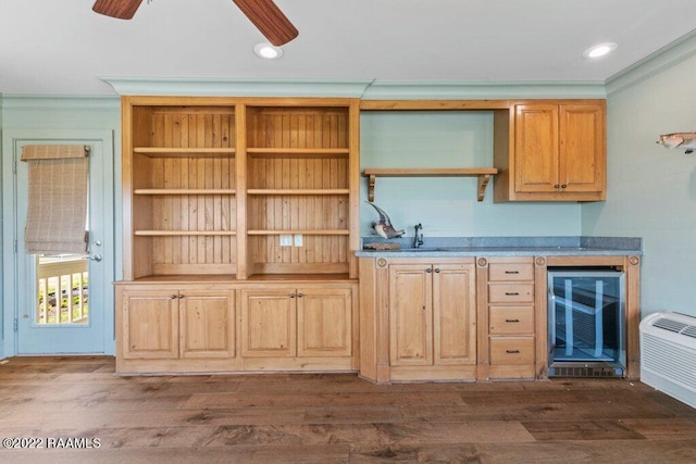 interior space with ceiling fan, dark wood-type flooring, and ornamental molding