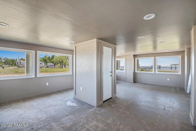 empty room with concrete flooring