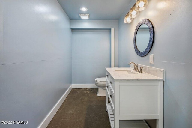 bathroom with toilet and vanity