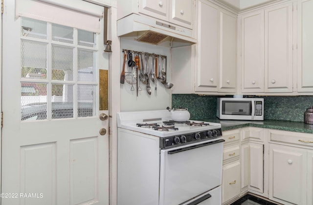 kitchen featuring white cabinets, backsplash, premium range hood, and white appliances