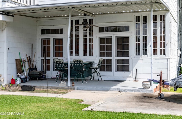 exterior space with french doors, a patio area, and ceiling fan