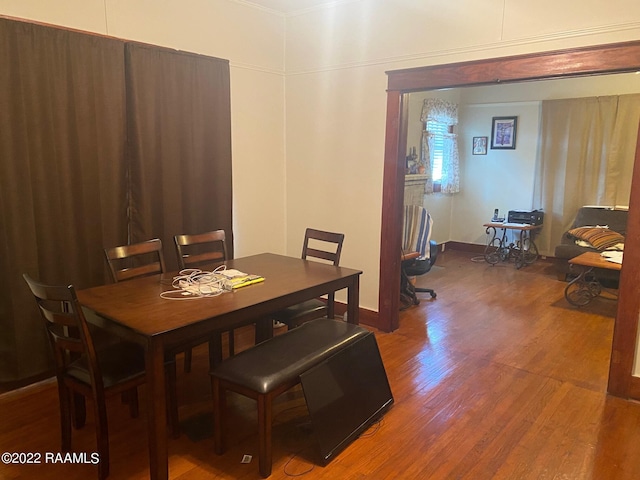 dining area with hardwood / wood-style floors