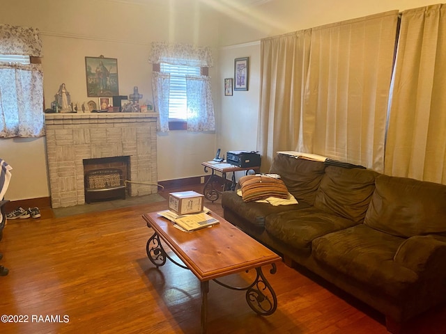 living room featuring hardwood / wood-style flooring and a fireplace