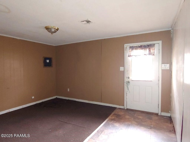 entryway featuring ornamental molding, electric panel, visible vents, and baseboards