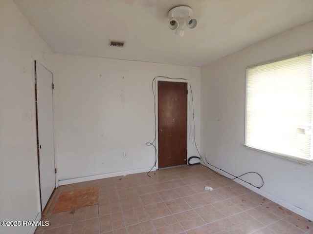 805 Edna St, New Iberia, LA 70560 - empty room with baseboards and visible vents