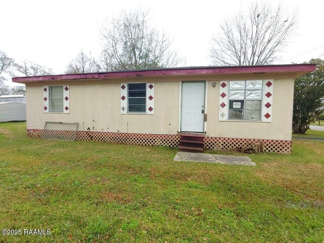 805 Edna St, New Iberia, LA 70560 - view of front of home with entry steps and a front yard