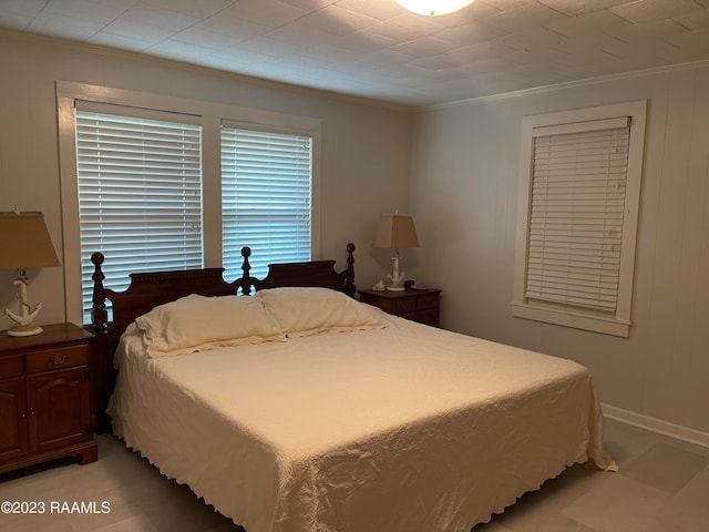 bedroom with ornamental molding