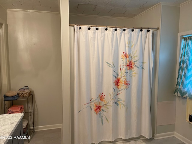 bathroom featuring vanity and ornamental molding