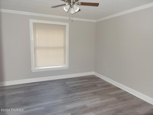 spare room featuring dark hardwood / wood-style flooring, ceiling fan, and ornamental molding