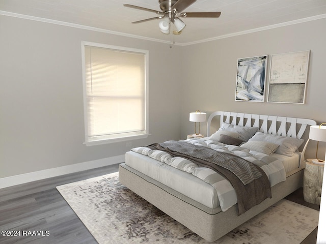 bedroom featuring ceiling fan, ornamental molding, and wood-type flooring