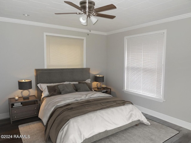 bedroom with ceiling fan, ornamental molding, and dark wood-type flooring