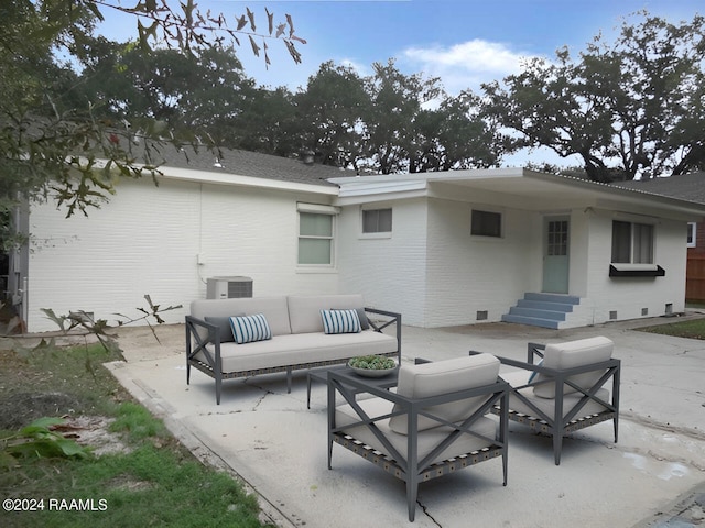 exterior space featuring an outdoor living space and central air condition unit