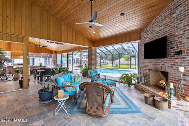 view of patio with an outdoor living space with a fireplace and ceiling fan