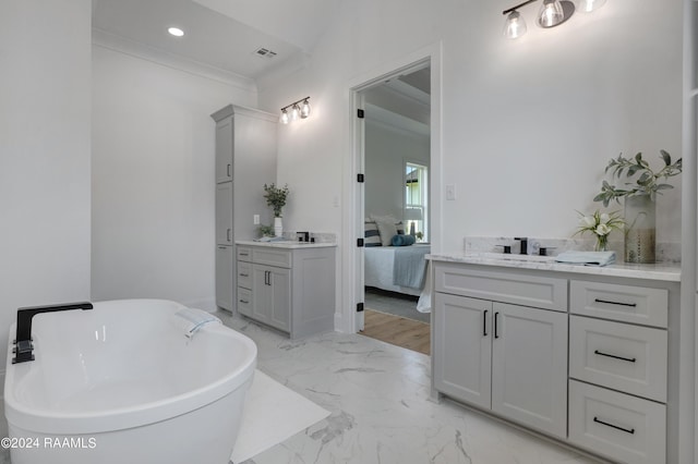 bathroom with vanity and a bathtub