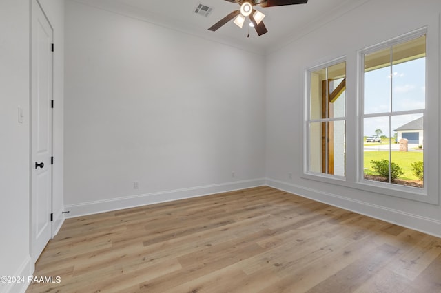 spare room featuring crown molding, ceiling fan, and light hardwood / wood-style floors