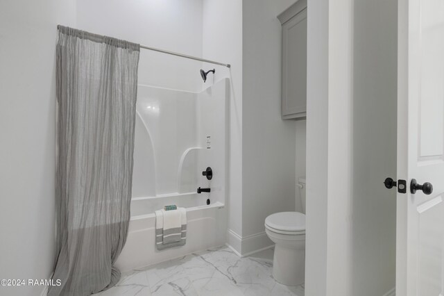 bathroom featuring toilet and shower / tub combo