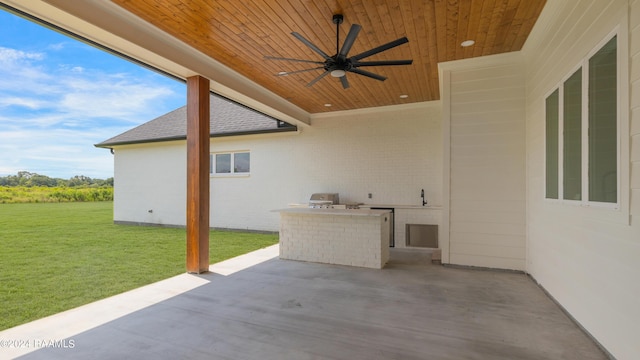 view of patio / terrace featuring an outdoor kitchen, ceiling fan, and area for grilling