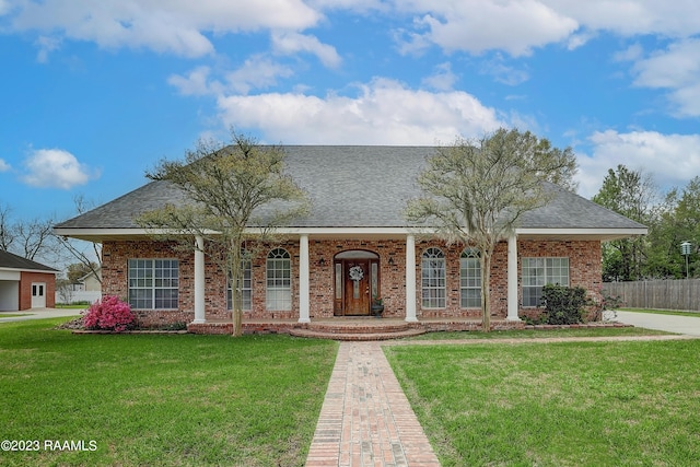 view of front of property with a porch and a front yard