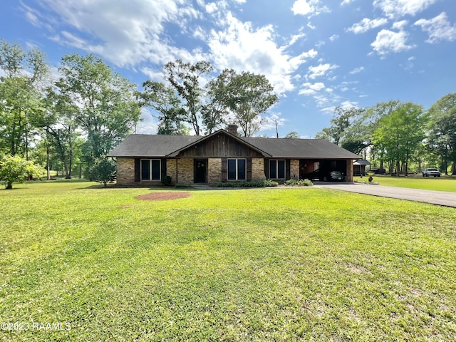 ranch-style home featuring a front yard