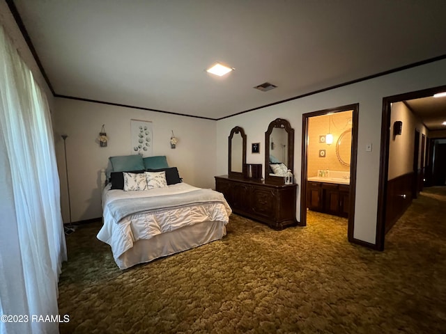 carpeted bedroom featuring ensuite bath