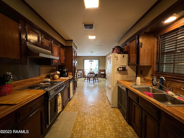 kitchen with sink, stove, butcher block countertops, light tile flooring, and dark brown cabinetry