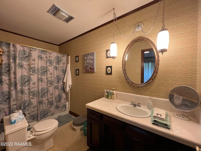 bathroom with ornamental molding, toilet, and vanity