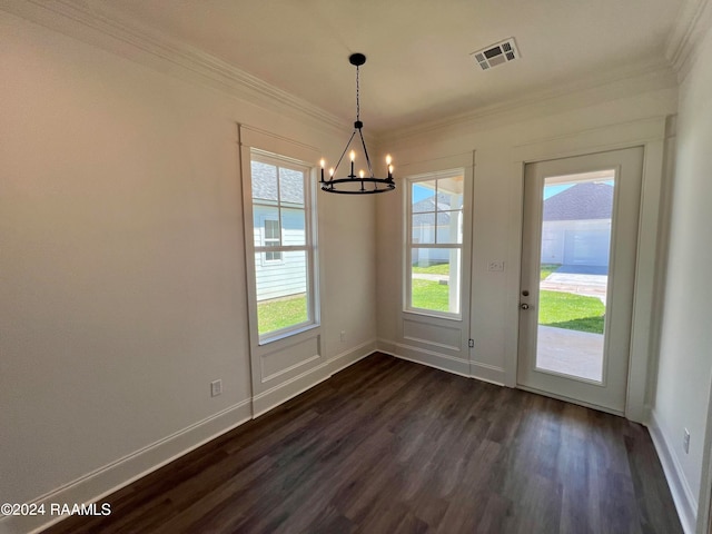 unfurnished dining area with ornamental molding, dark hardwood / wood-style flooring, and a notable chandelier