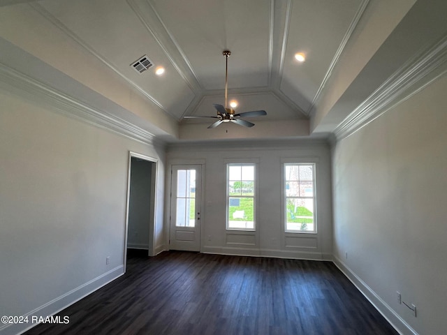 empty room with dark hardwood / wood-style flooring, ceiling fan, crown molding, and lofted ceiling