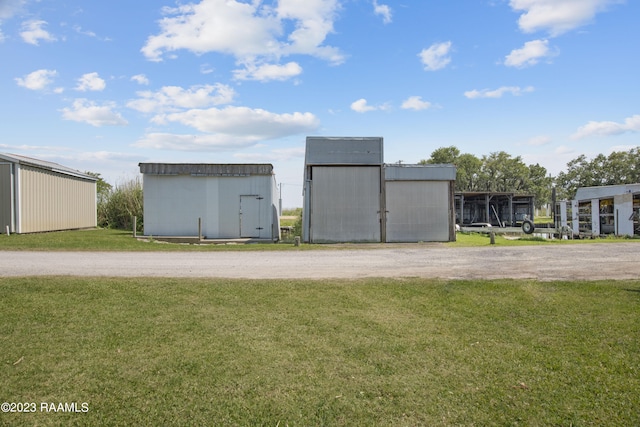 view of shed / structure with a yard