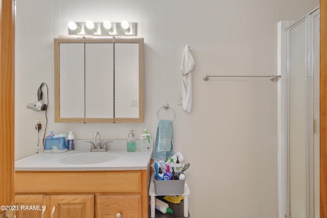 bathroom with vanity and walk in shower