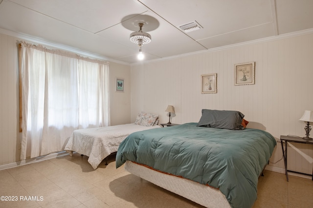 bedroom featuring light tile flooring and ceiling fan