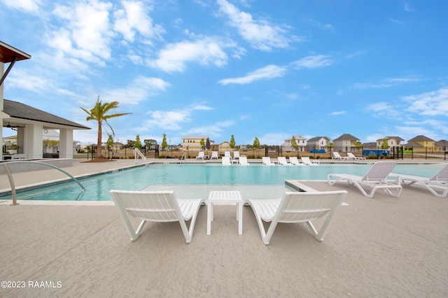 view of swimming pool with a patio area