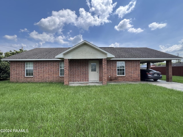 single story home with a carport and a front yard