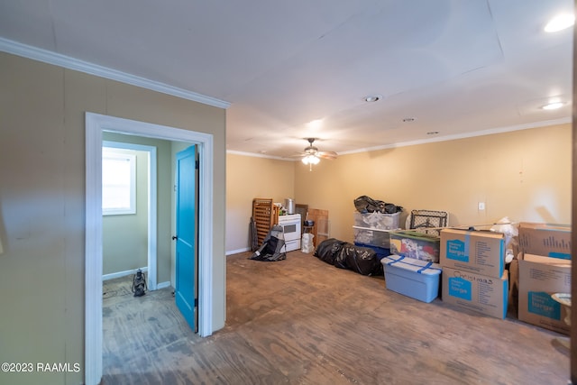 interior space featuring ceiling fan, ornamental molding, and dark hardwood / wood-style flooring